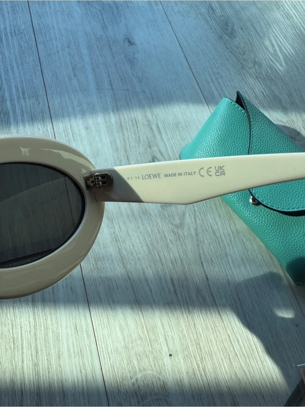 Loewe Ivory Oval Sunglasses with Dark Lenses